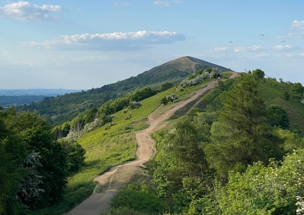 A walking path along the green ridge of the Malvern Hills