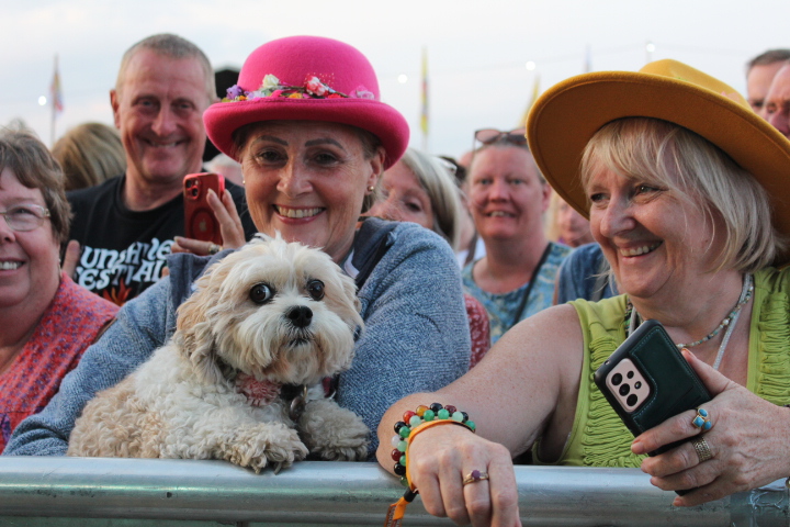 2 laughing ladies and their dog enjoying Sunshine Festival 2 laughing ladies and their dog enjoying Sunshine Festival